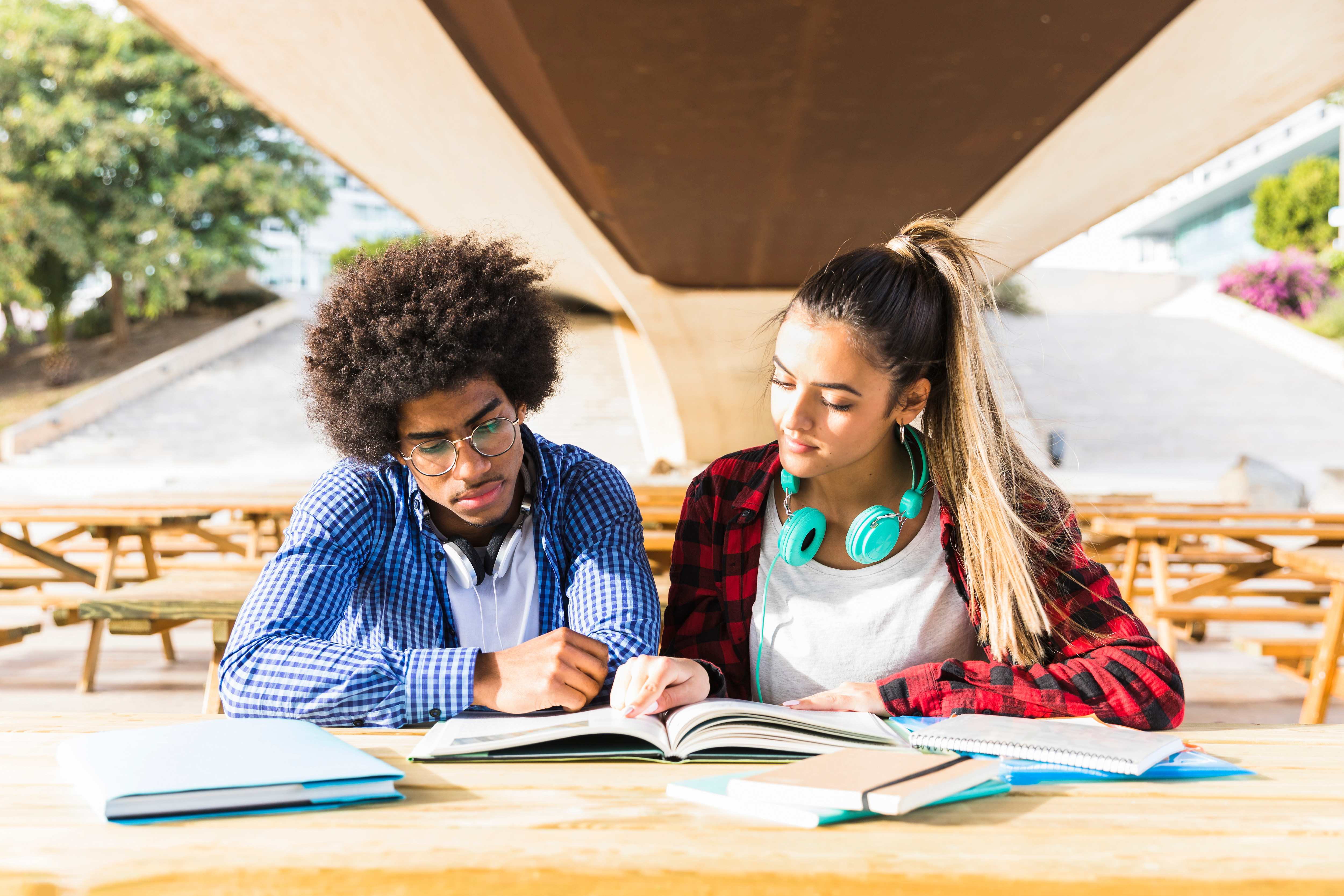 Two Students Reading Together - Sourcely Study College Hacks